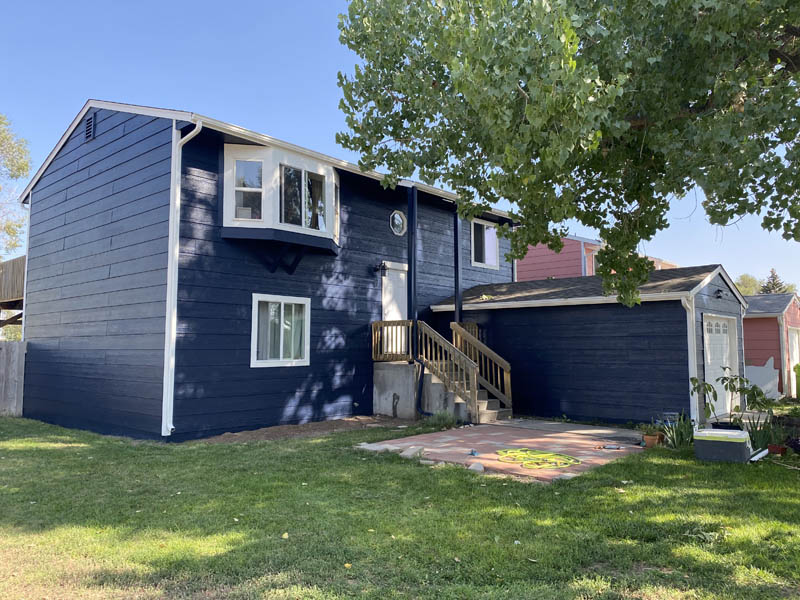 Blue house painted by Liveoak Painting in Wellington, Colorado